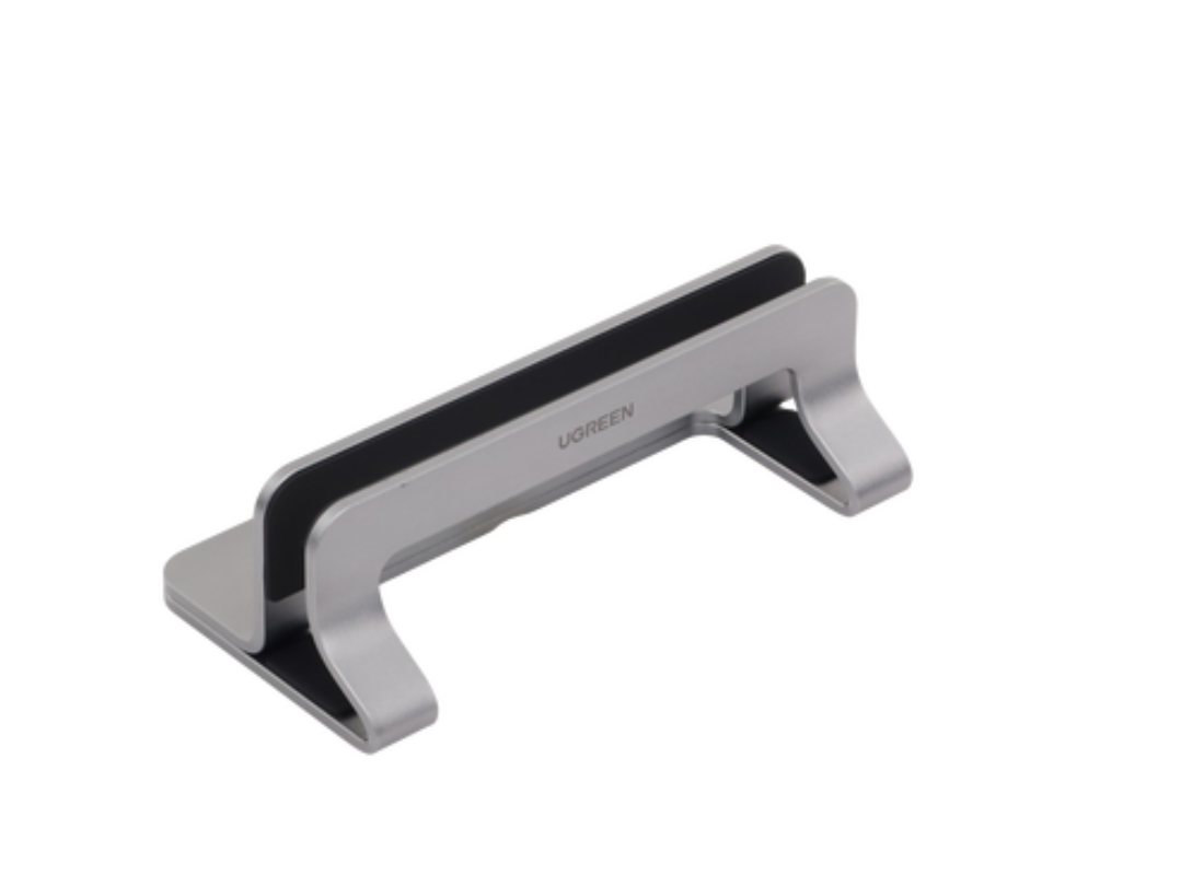 Soporte Vertical para Laptop / Adecuado para escritorio / Anchura Ajustable (12-26mm) / Amplia compatibilidad / Anti-Arañazos / Anti-Deslizante /Ajustable Mediante Tornillos / Color Plata / Aluminio + Silicona